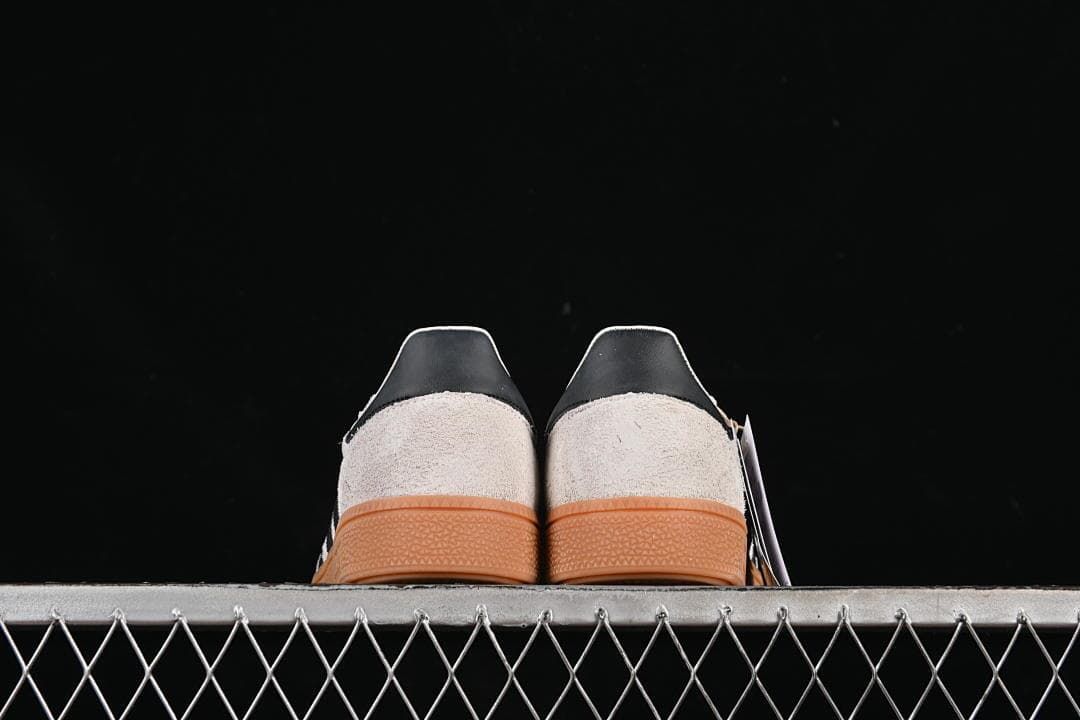 Rear view of the pair showing black heel details and gum soles