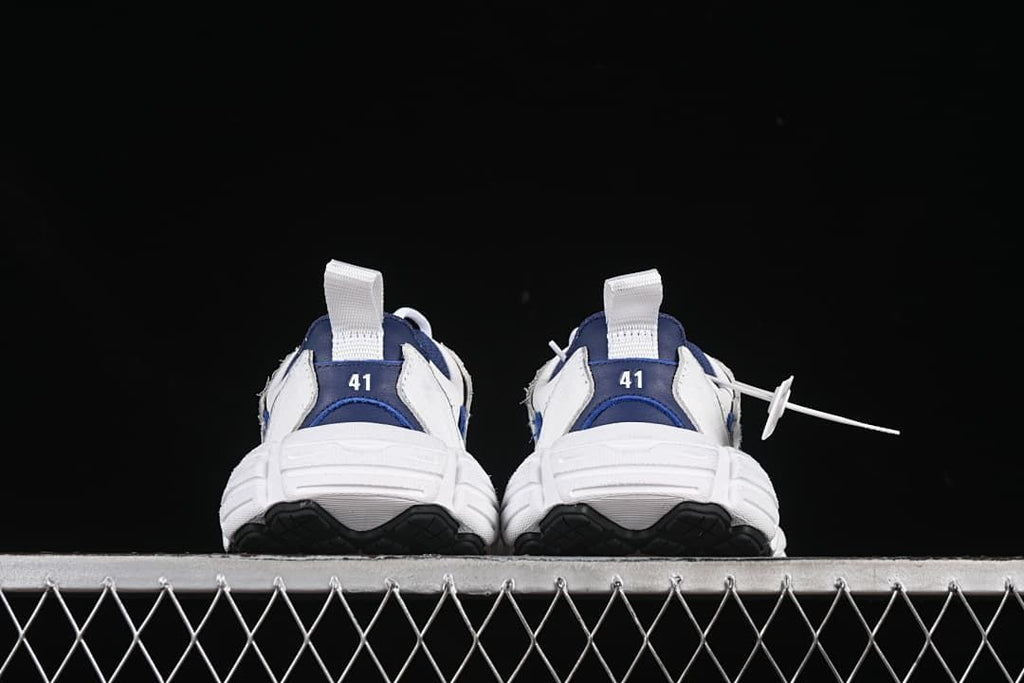 Rear view of both sneakers with heel pull tabs and size markings 41.