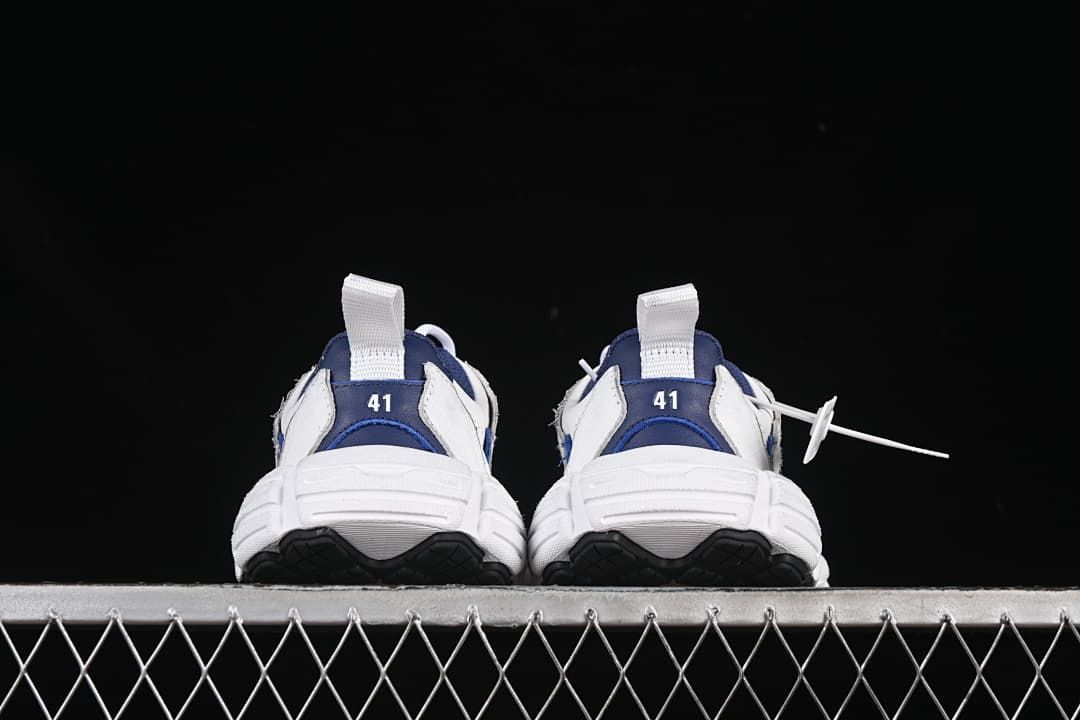 Rear view of both sneakers with heel pull tabs and size markings 41.