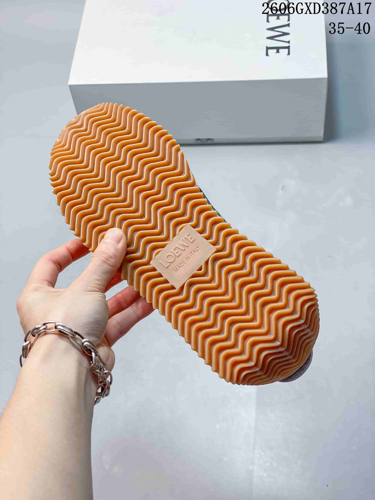 Close-up of the gum-colored outsole with a wavy tread pattern