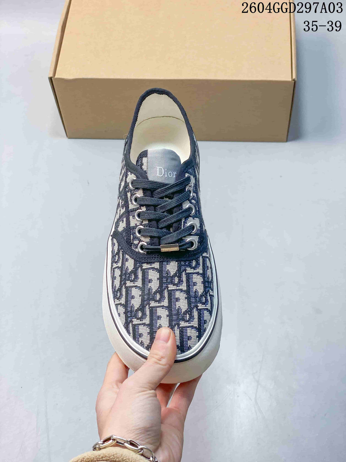 Front view of the sneaker showing its patterned upper and dark laces