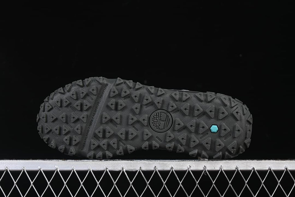 Underside view showing the deeply patterned black outsole.