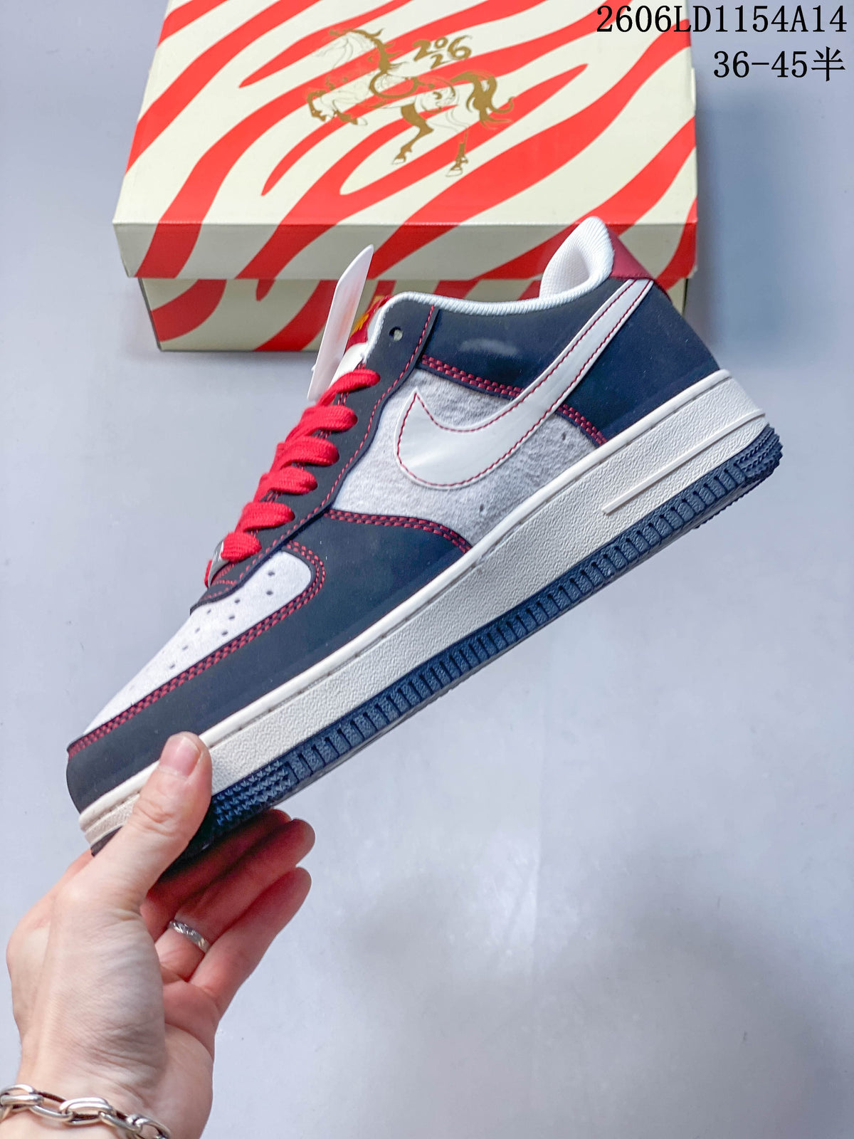 Side view of the low-top sneaker with white side panel and red stitching