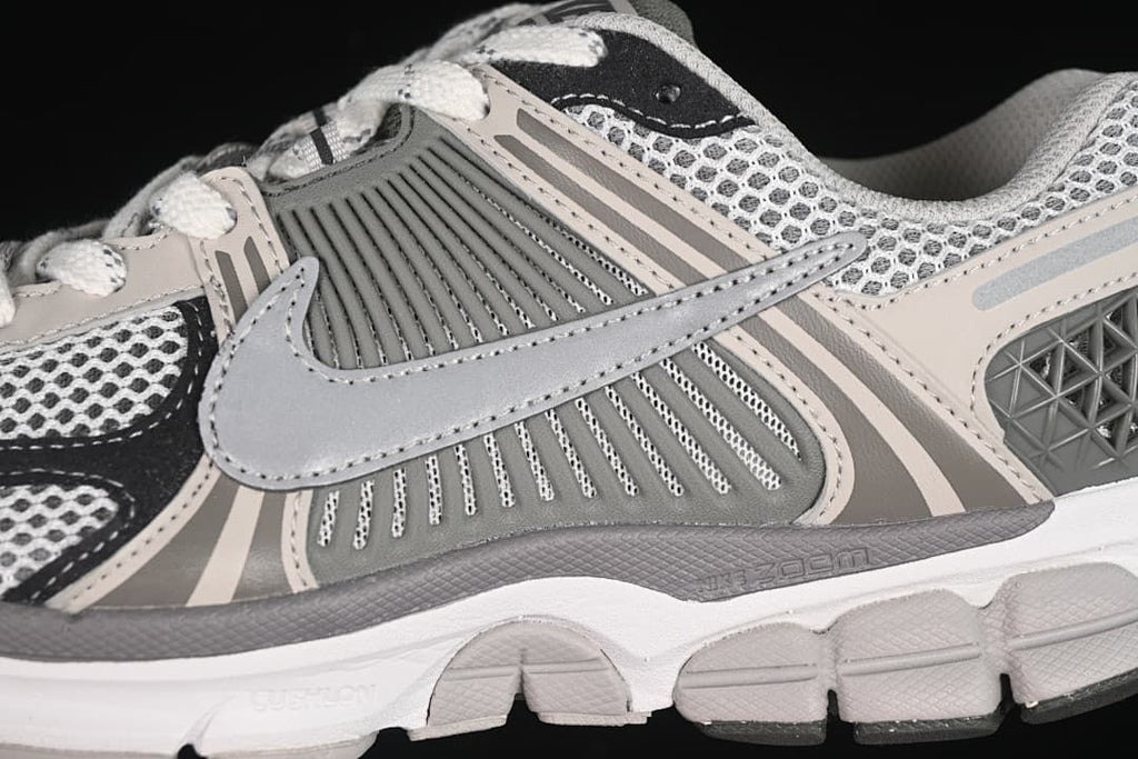 Close-up of the side Swoosh, layered panels and midsole details.