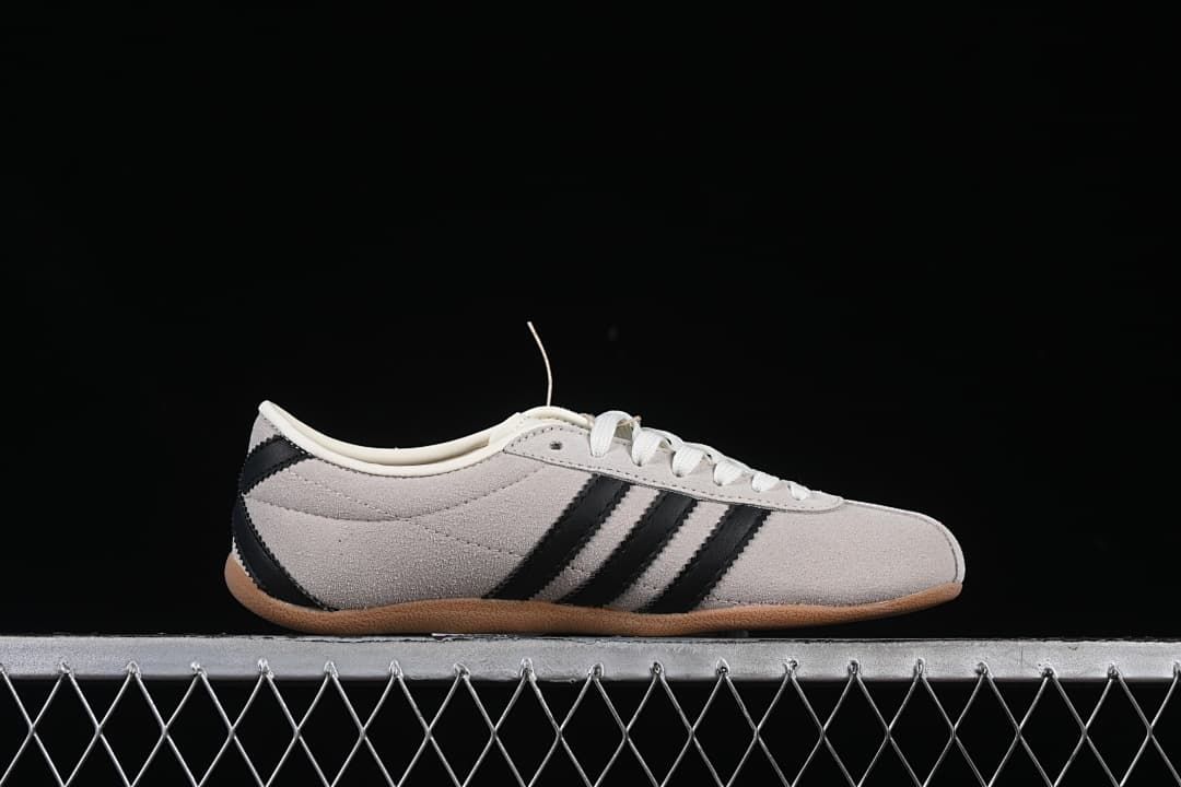 Side profile showing the low silhouette and three black stripes