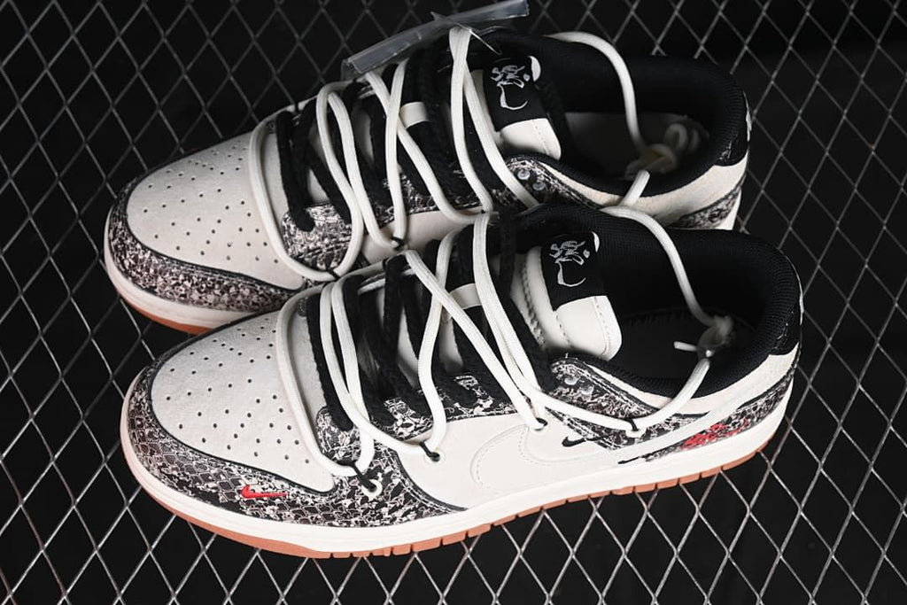 Pair of white and black patterned low-top sneakers viewed from above