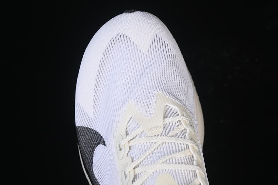 Close-up of the white textured toe box and laces