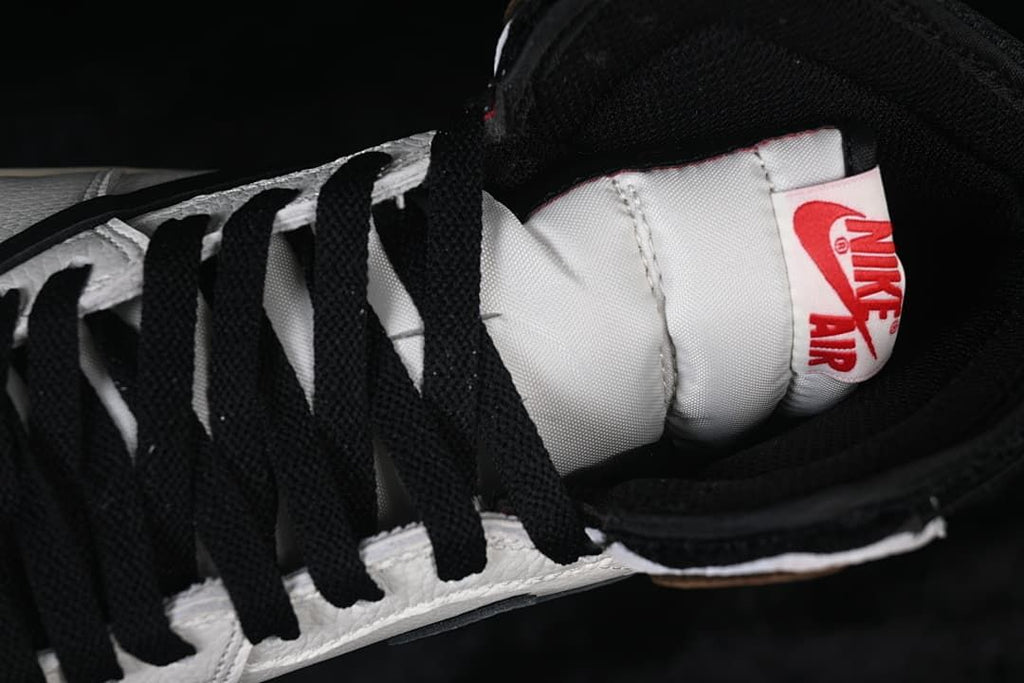 Close-up of black laces, tongue, and tongue label