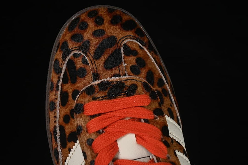 Top-down view of the leopard-print toe and orange-red laces