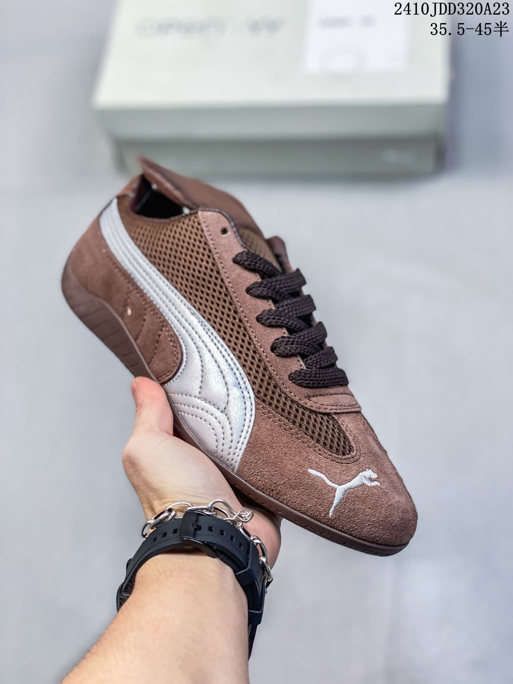 Angled view of the brown Puma Speedcat sneaker with silver side stripe