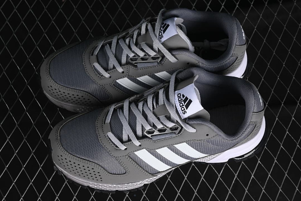 Pair of gray adidas sneakers photographed from above at an angle
