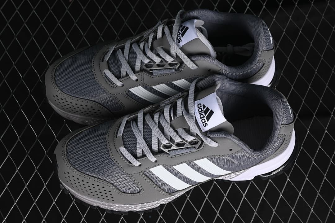 Pair of gray adidas sneakers photographed from above at an angle