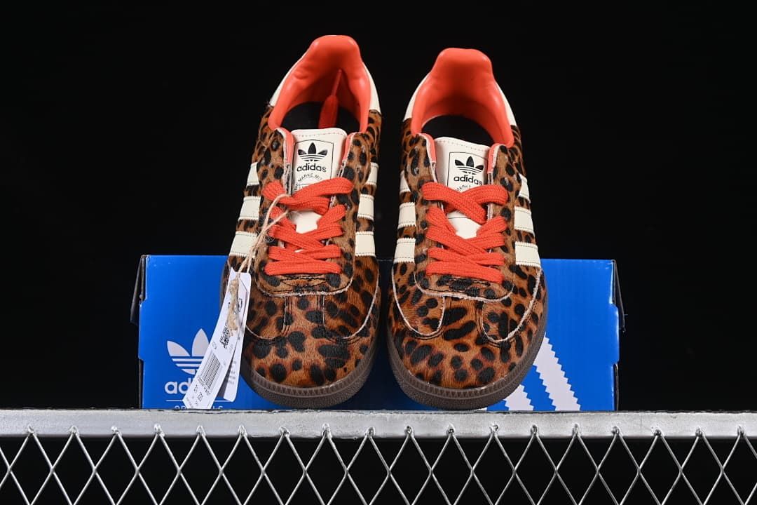Front view of the pair with leopard-print uppers and orange-red laces