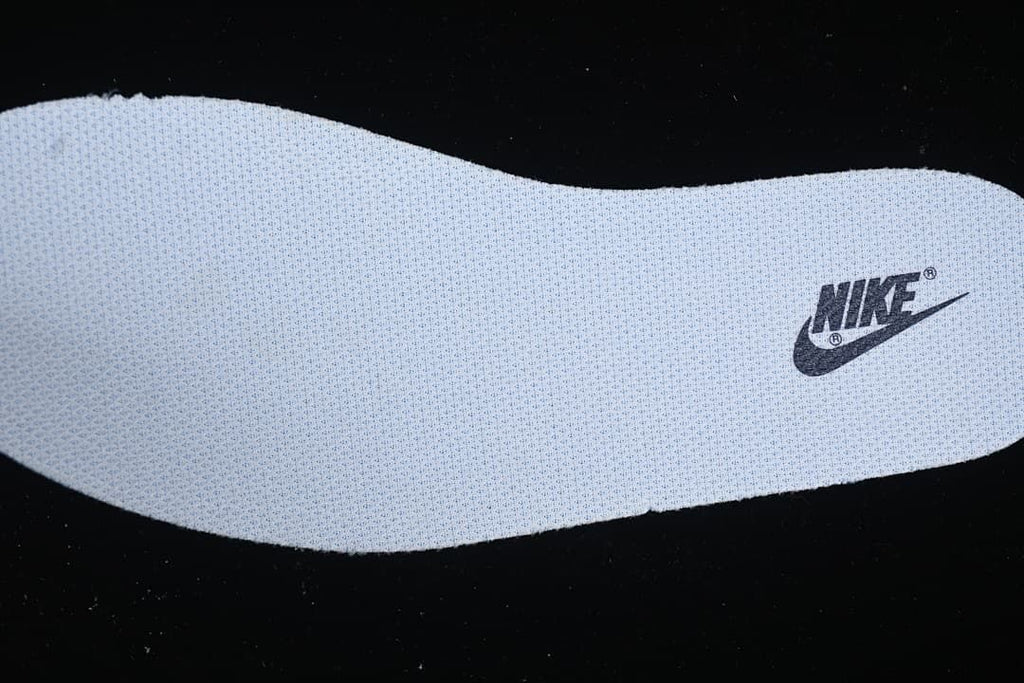 Close-up of a light-colored insole with Nike branding.