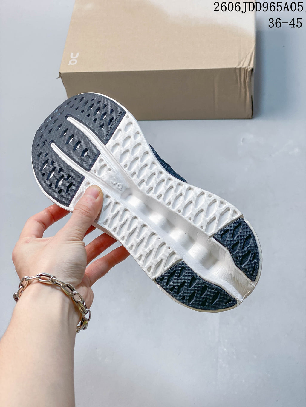 Underside view showing the patterned sole and dark outsole sections