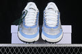 Front view of grey, white, and light-blue ODSY-2000 sneakers with arrow-shaped details