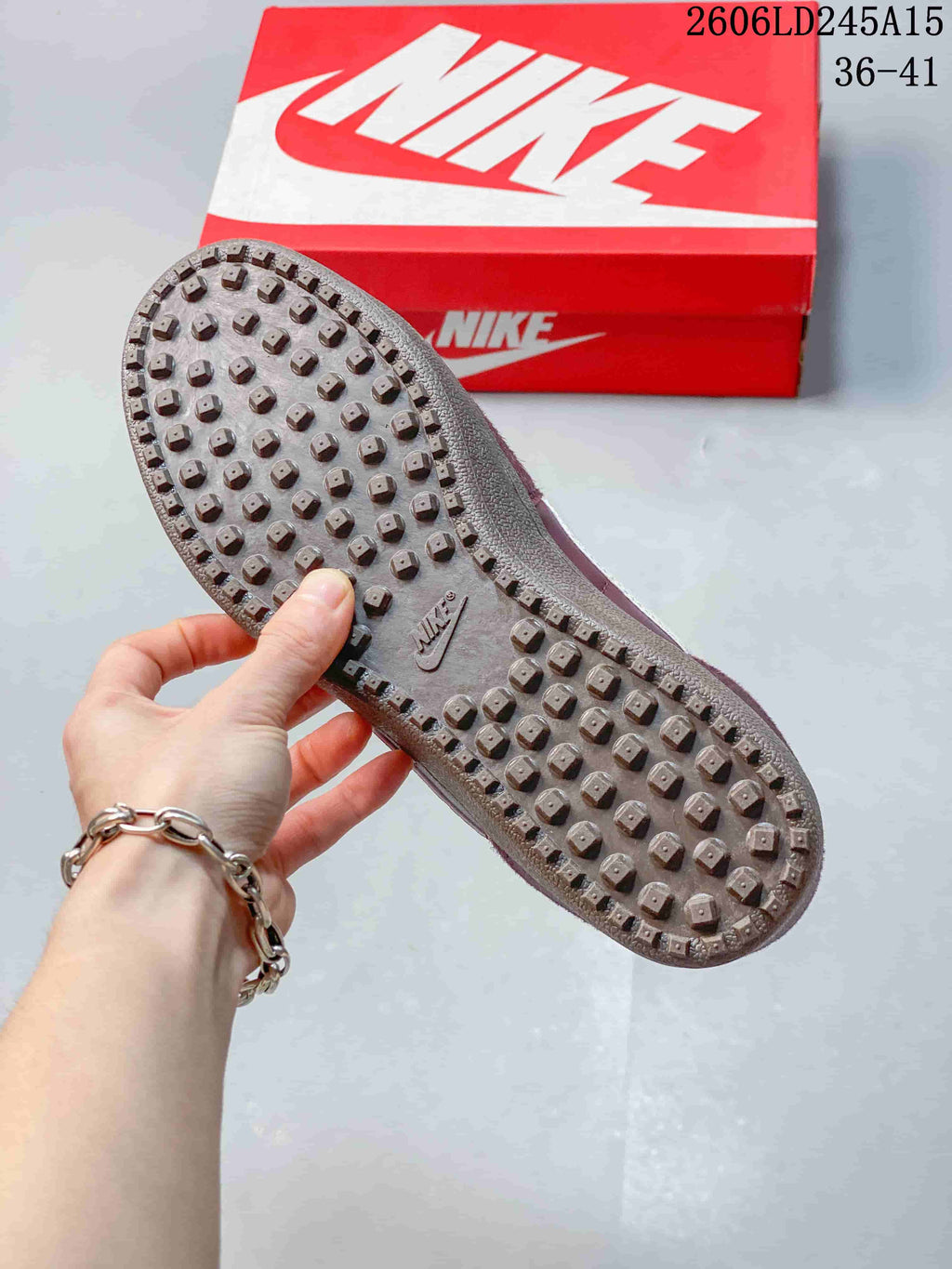 Close-up of the sneaker outsole showing a raised lug pattern.
