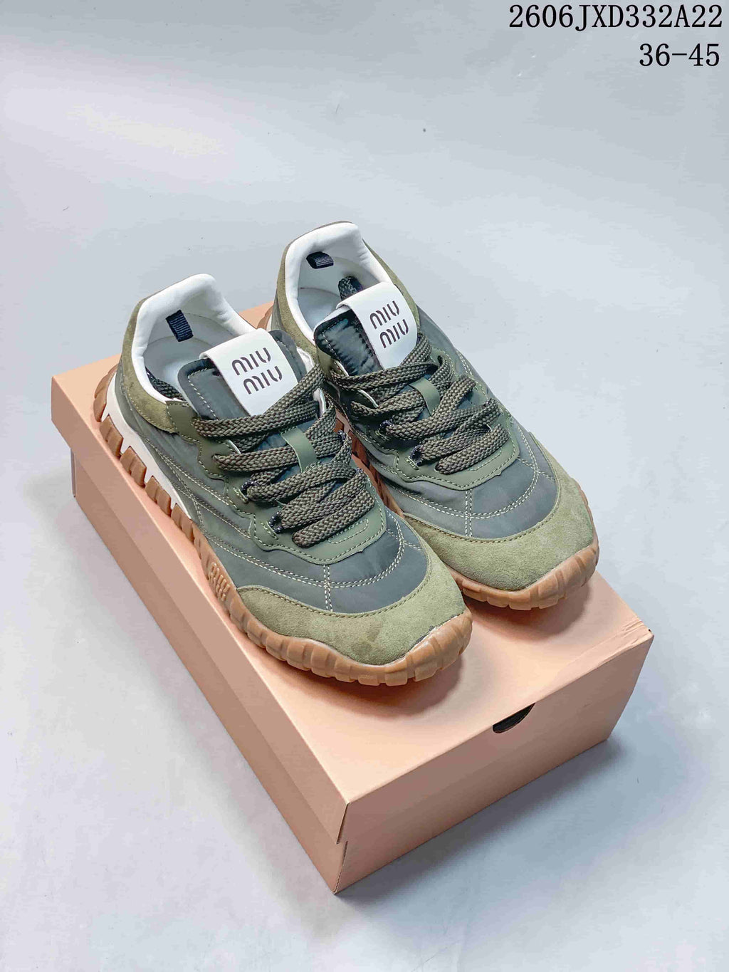 Pair of green and gray Miu Miu Tyre low-top lace-up sneakers with chunky tan outsoles