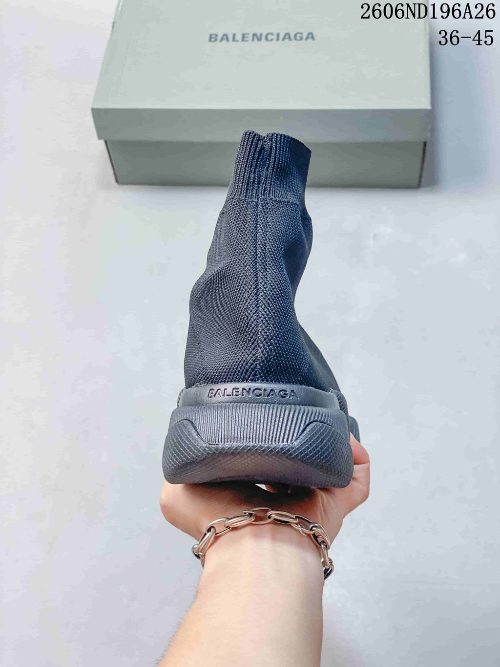 Rear view showing the high knit-look collar and sculpted heel of a charcoal grey sneaker