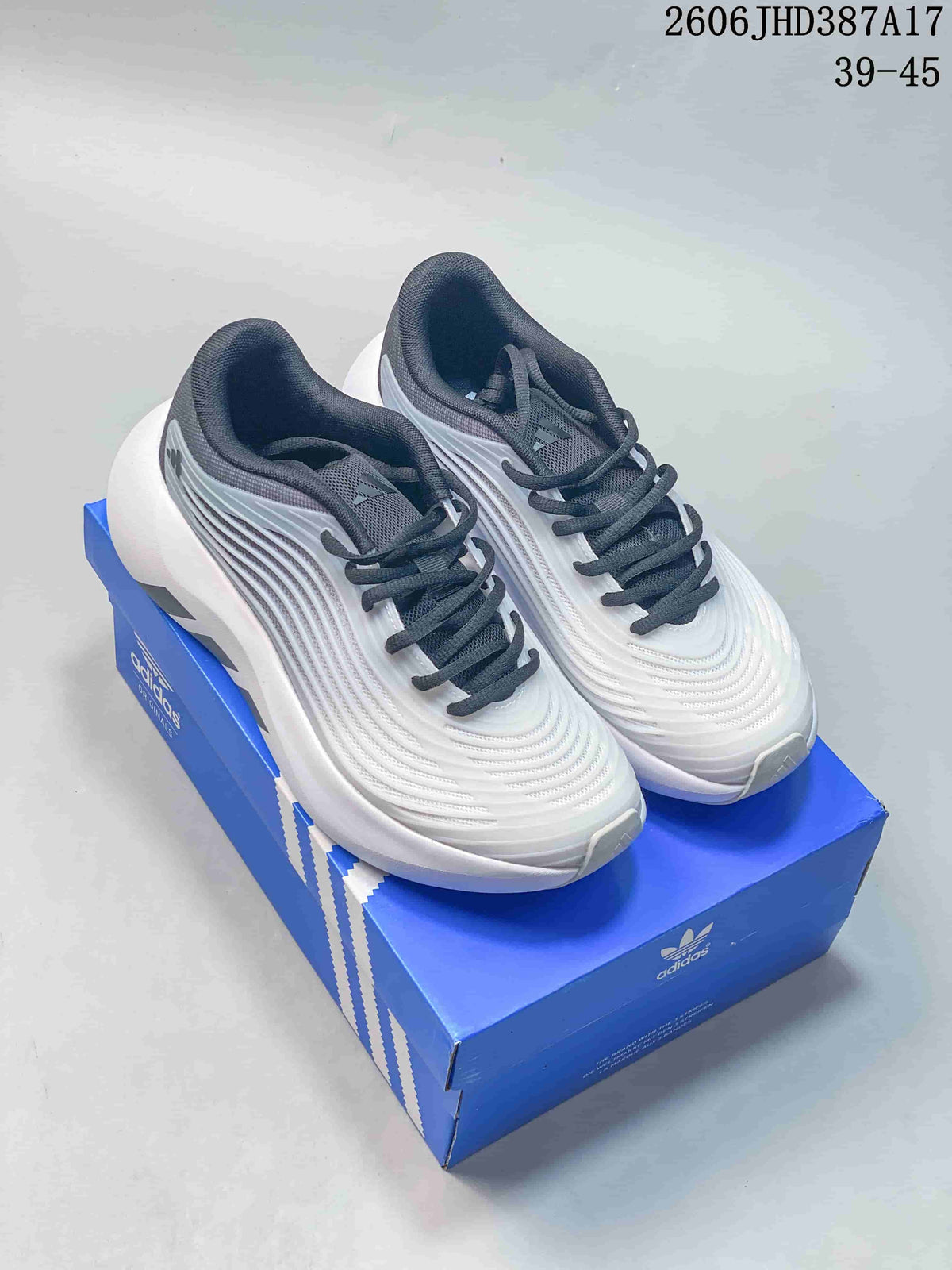 White and grey adidas Purechill V2 sneakers shown from above on a blue shoe box.