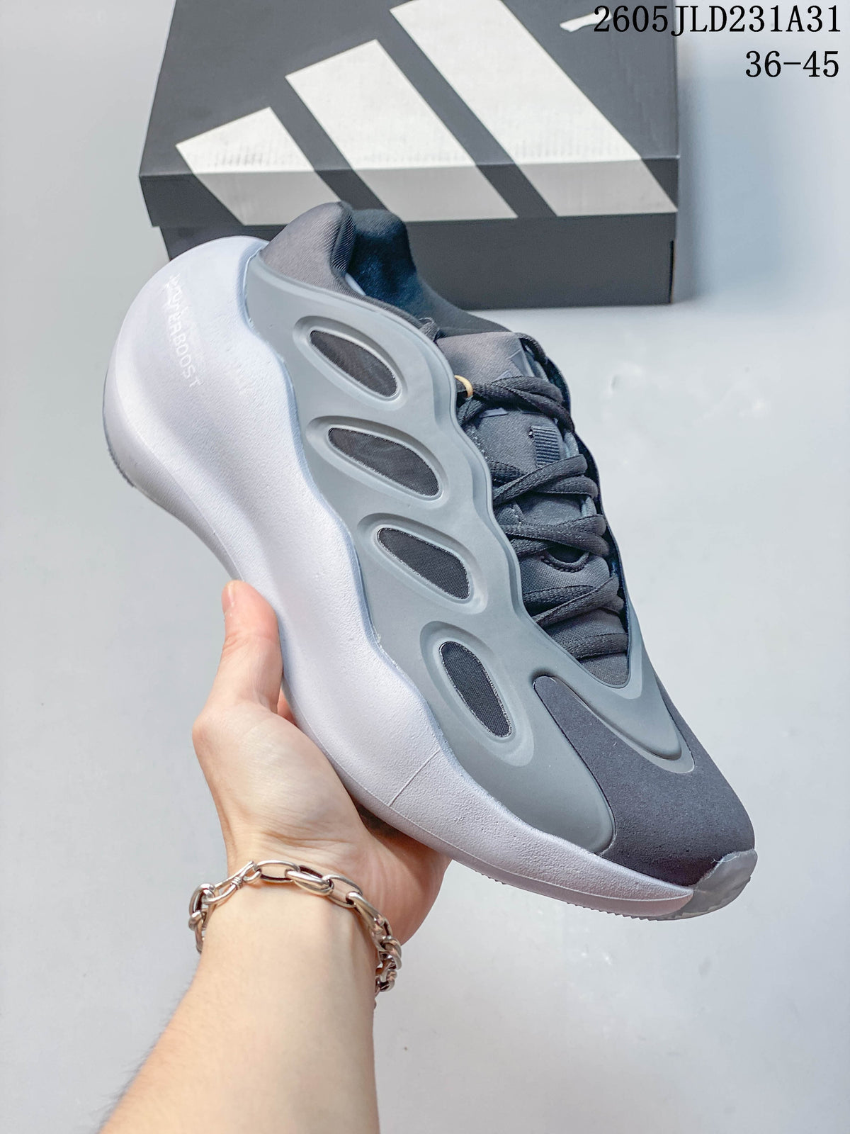 Side view of a grey Adidas Hyperboost sneaker showing the sculpted sole and side panels.