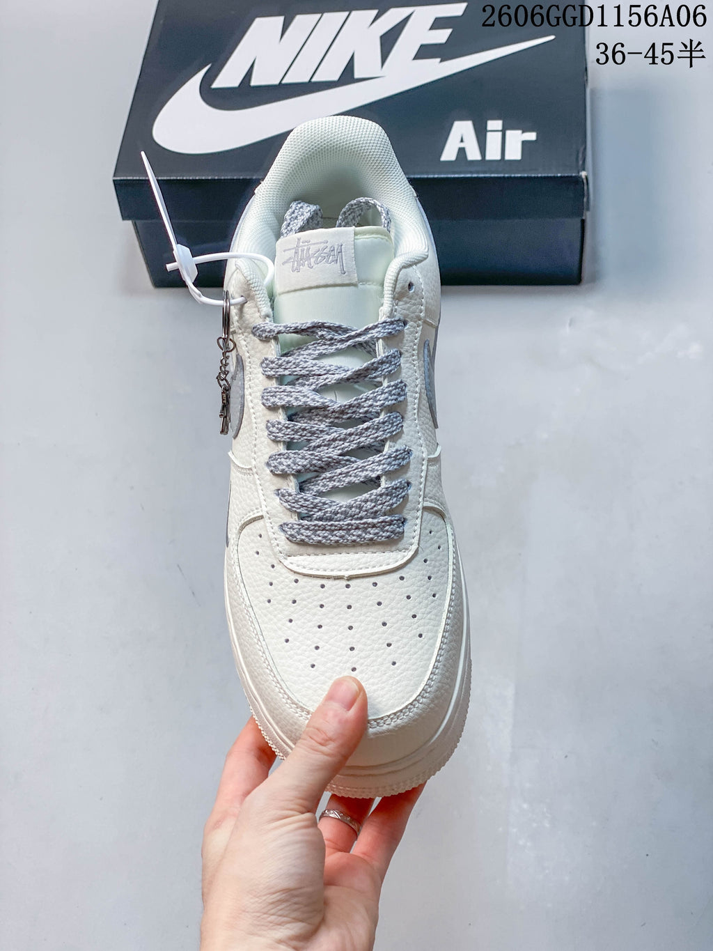Top view of the sneaker showing grey laces and perforated toe panel