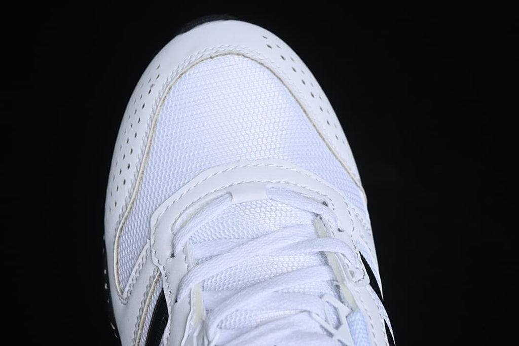 Top-down close-up of the perforated toe and lacing