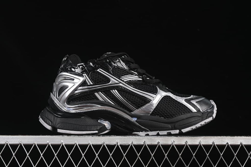 Side profile highlighting the layered black and silver construction.