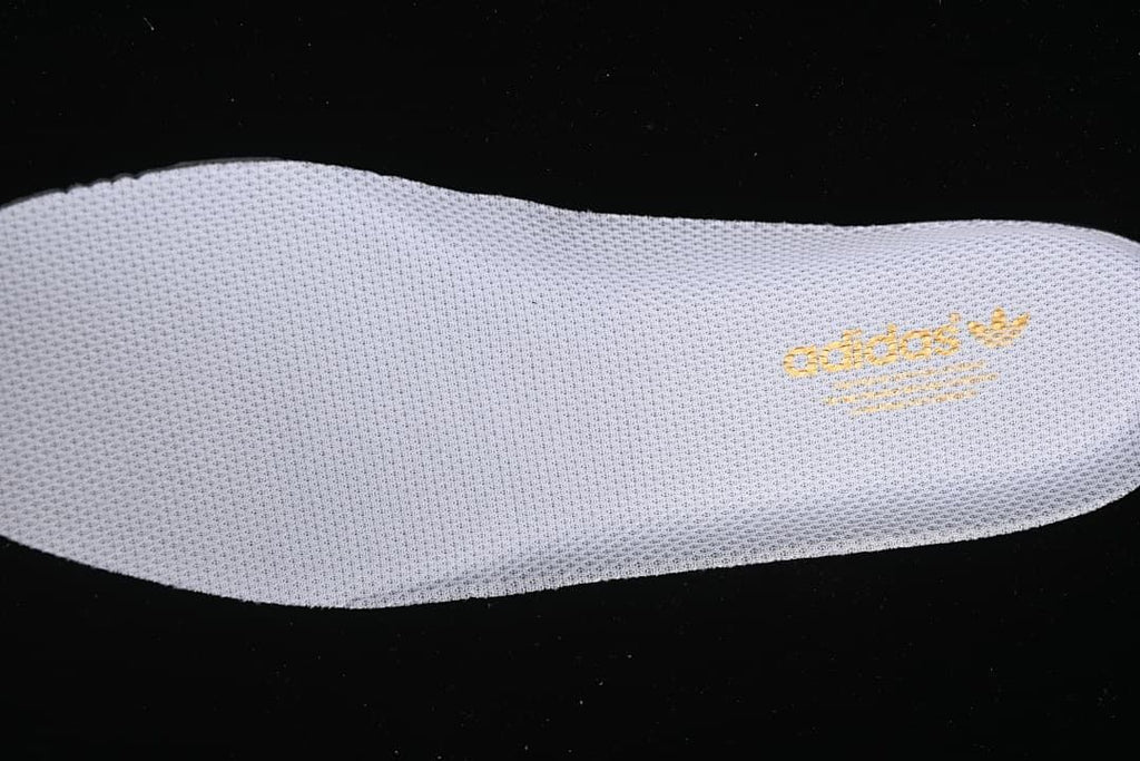 Close-up of the removable insole with adidas Trefoil branding