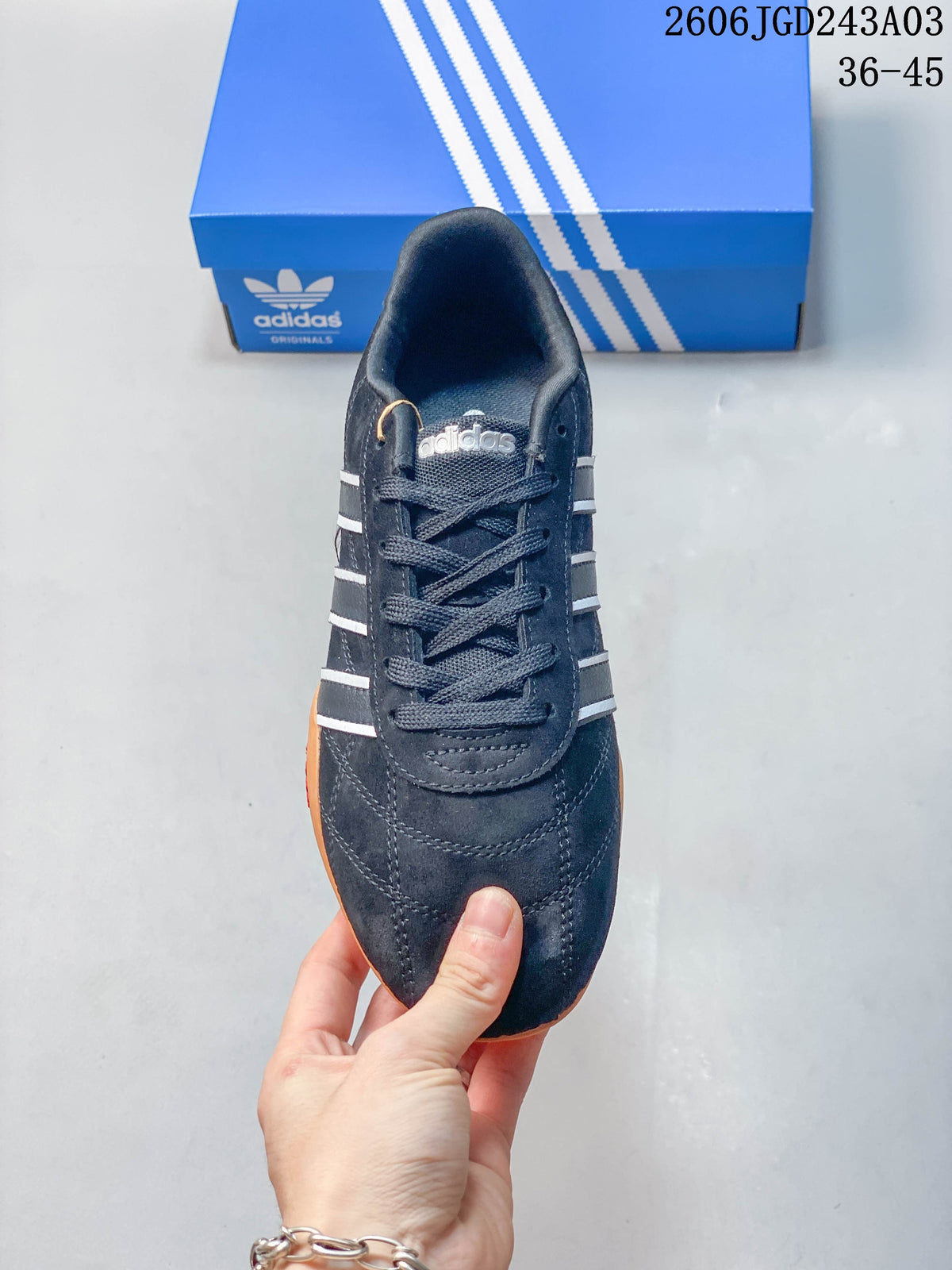 Top view of the black lace-up sneaker with contrasting side stripes