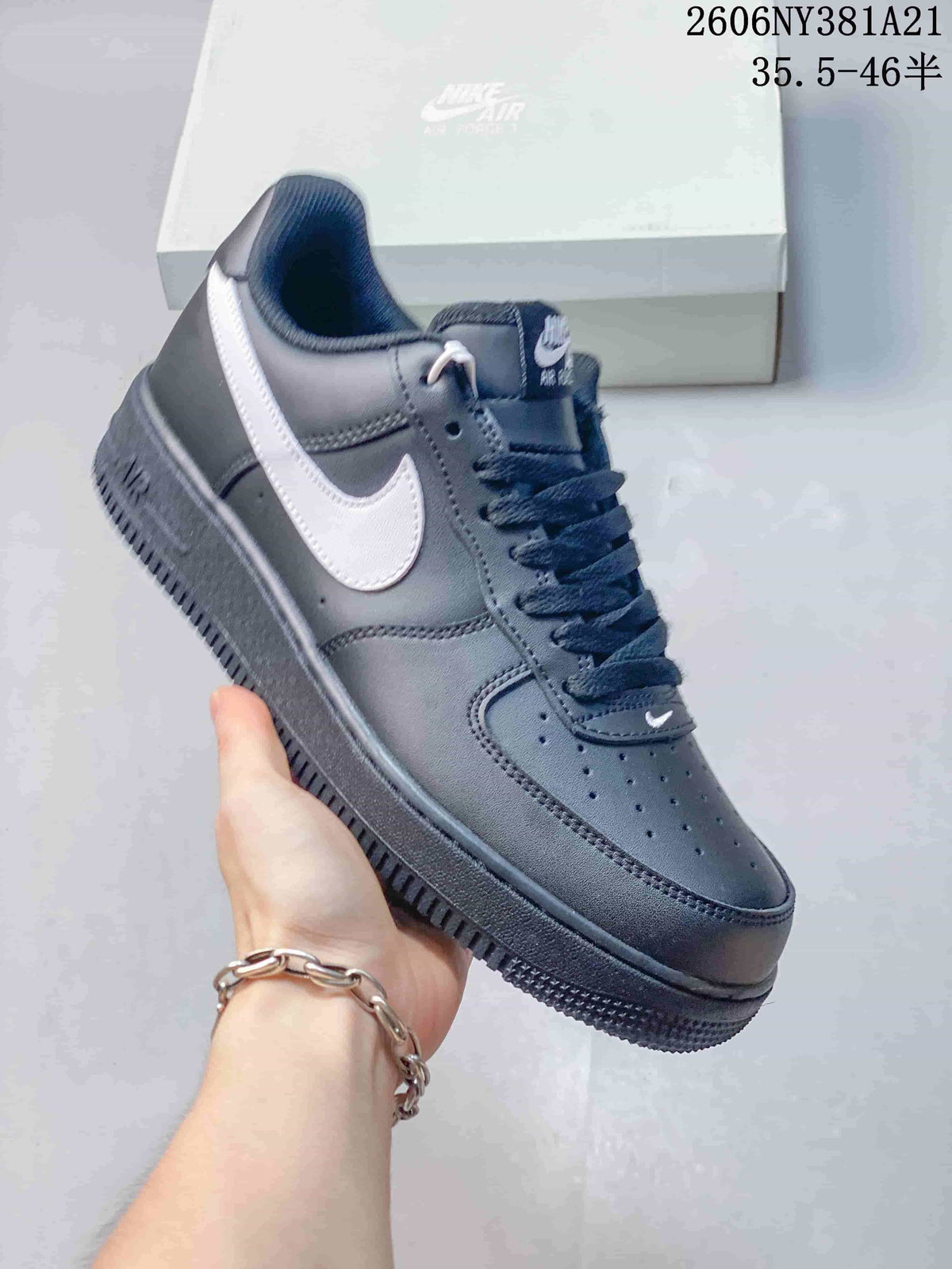 Side view of a dark sneaker with a white Swoosh