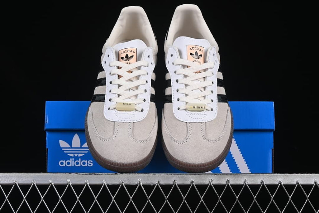 Front view of the sneakers placed on a blue shoe box