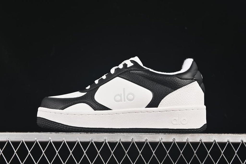Side view of the black-and-white low-top sneaker