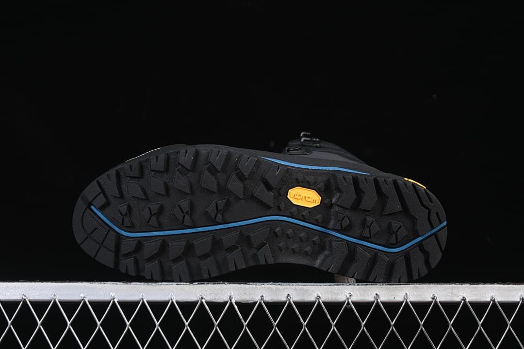 Underside of the boot showing the lugged outsole and Vibram mark