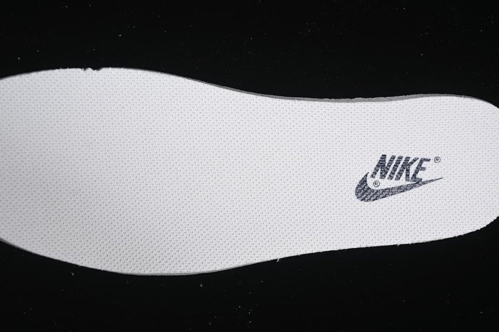 Textured white insole with a Nike logo.