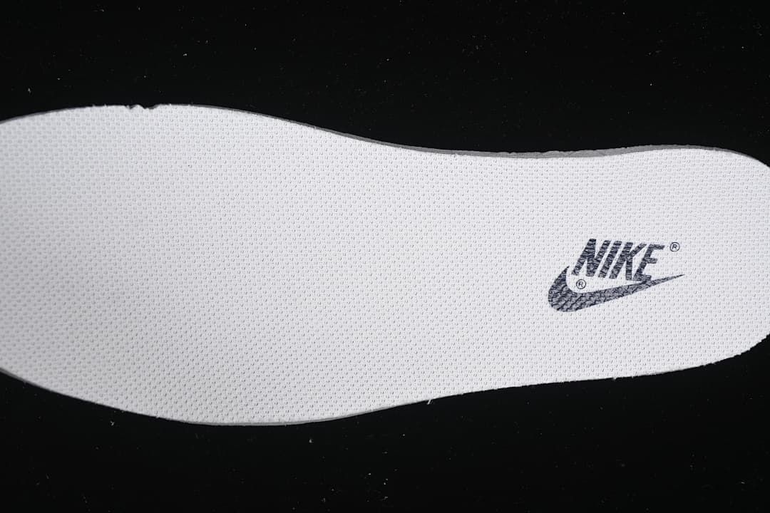 Textured white insole with a Nike logo.