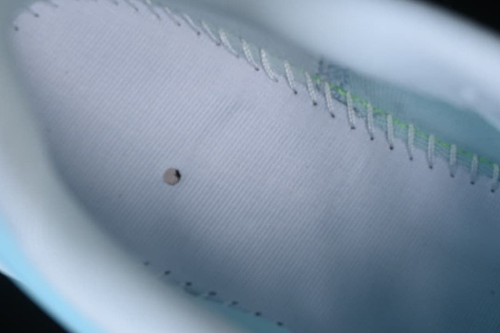 Close-up view inside the shoe showing the lining and stitching.