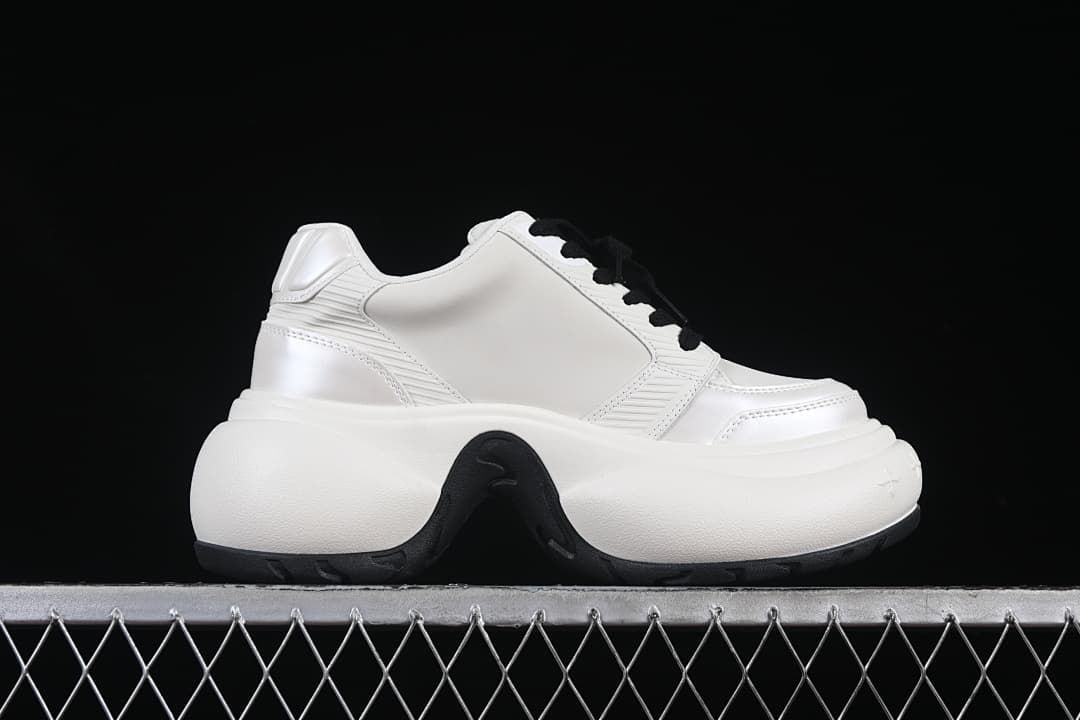 Side profile highlighting the thick sculpted sole and panel details