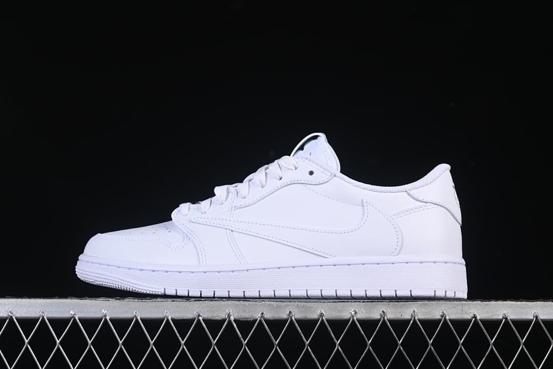 Side view of an all-white low-top sneaker against a dark background