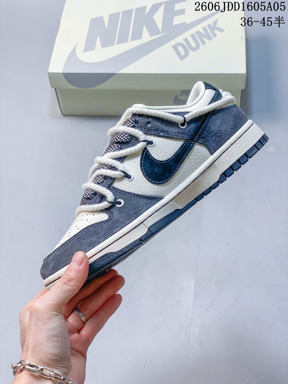 Side view showing the layered panels and Swoosh on a Nike SB Dunk Low sneaker