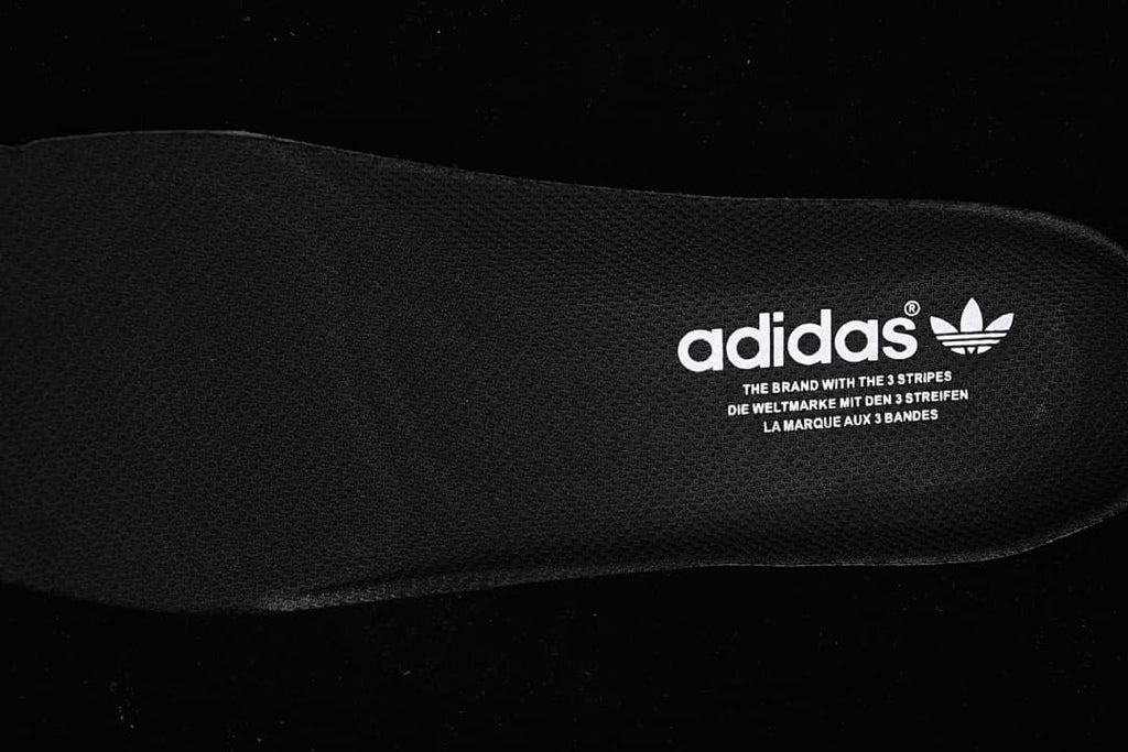 Close-up of the black insole with Adidas branding