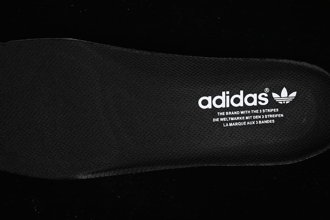 Close-up of the black insole with Adidas branding
