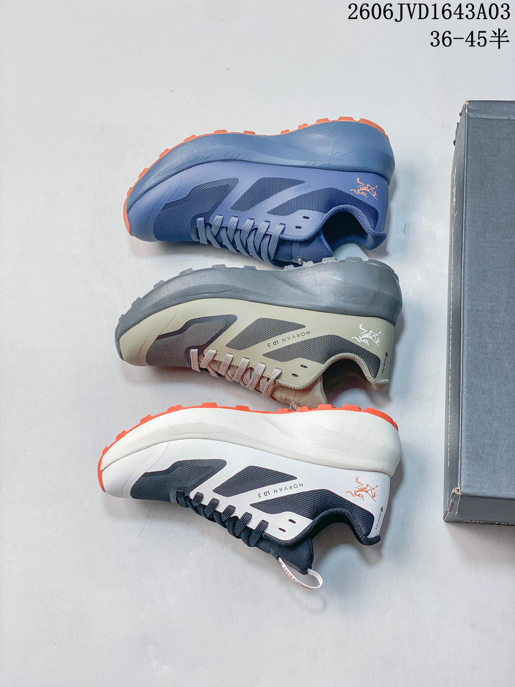 Navy and white Norvan LD 3 shoes on a shoe box