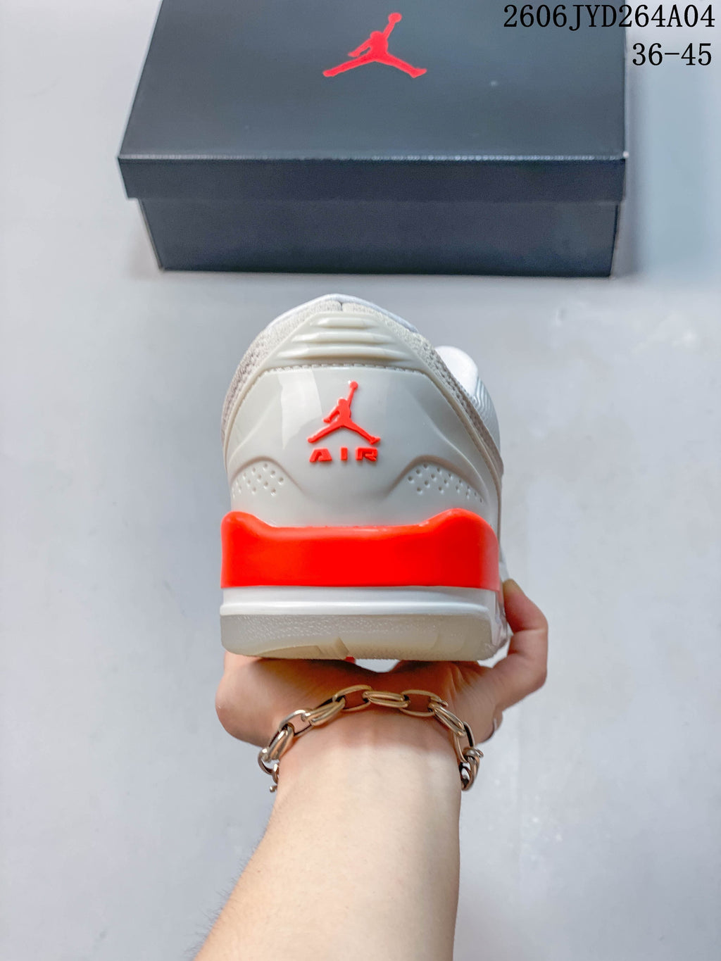 Rear view of a Jordan sneaker showing red-orange heel accents