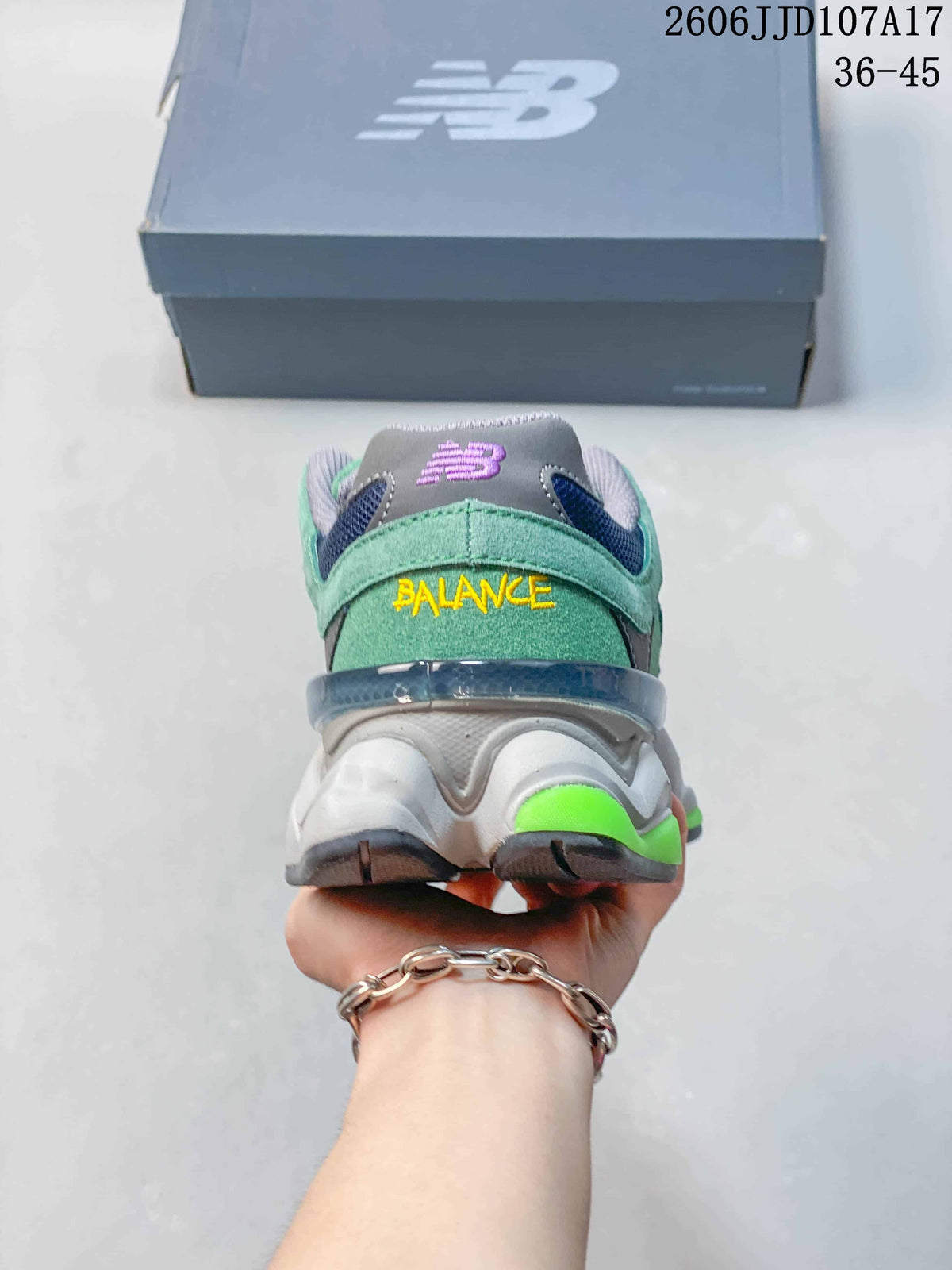 Rear view of the green New Balance U9060 with a layered heel and bright green sole accents