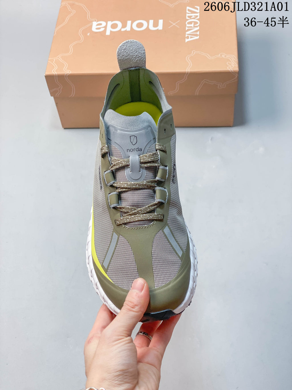 Front view showing the rounded toe, lace-up closure, and patterned upper panels.