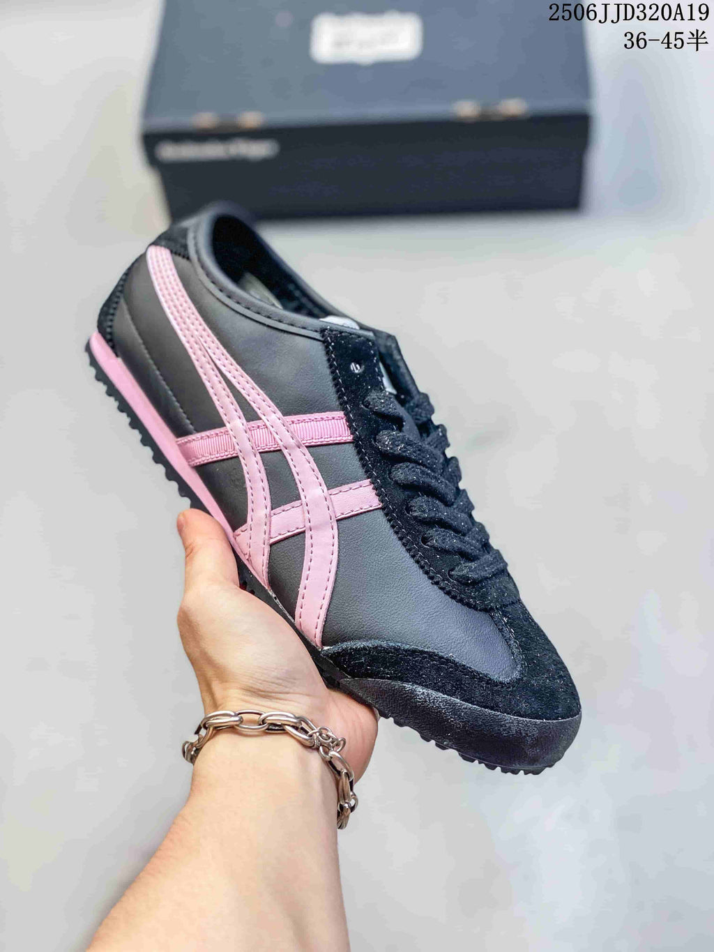 Dark gray low-top sneaker with pink side stripes and black trim