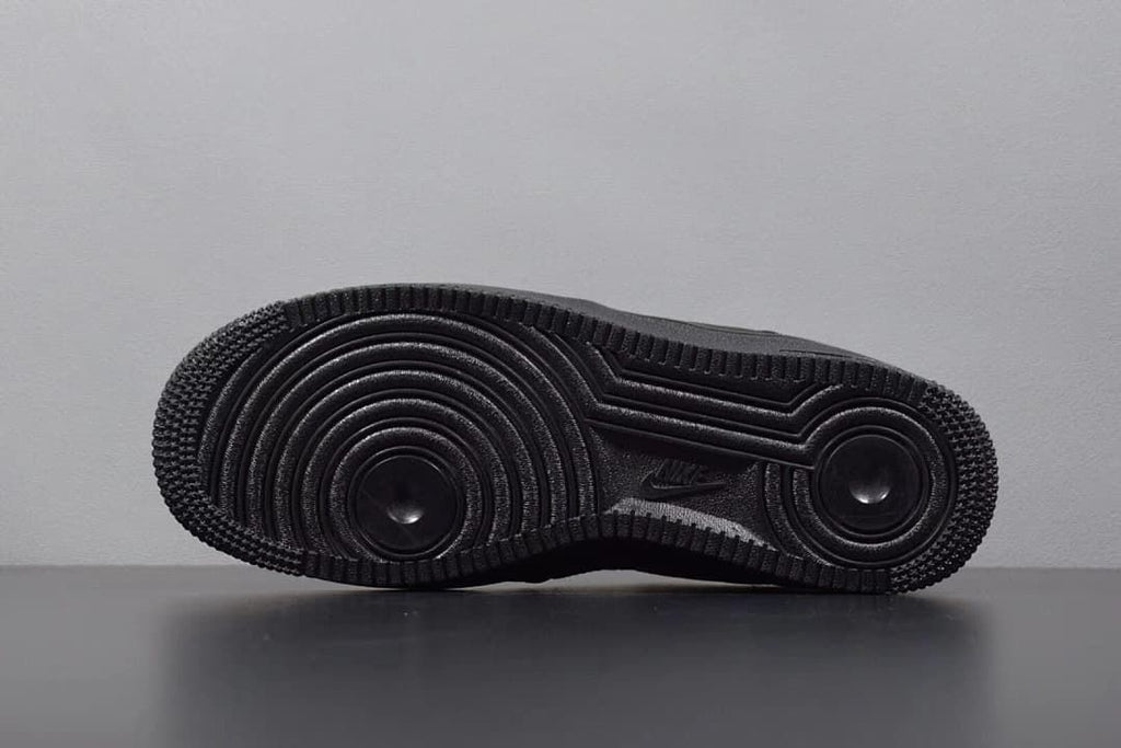 Underside view showing the circular tread pattern on the black outsole
