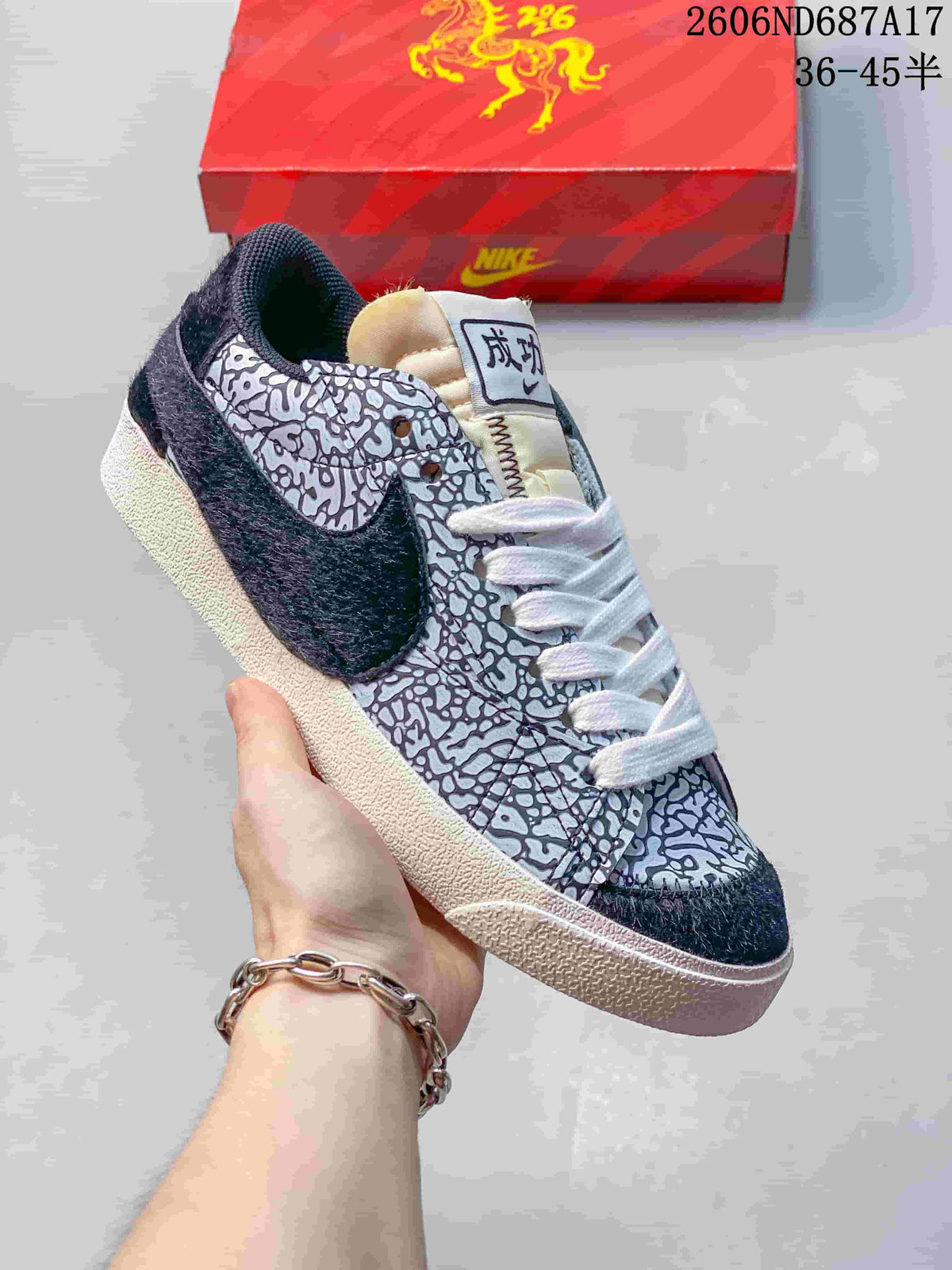 Angled close-up of the patterned upper and navy side Swoosh