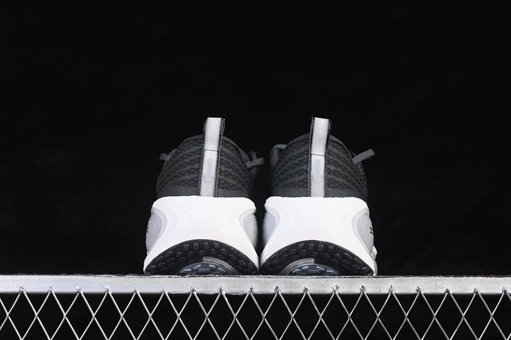 Rear view of the pair showing heel pull tabs and black tread.